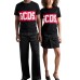 GCDS T-SHIRT UNISEX BLACK A MANICA CORTA REGULAR CON BANDA LOGO SERIFRATATO A CONTRASTO