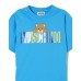 MOSCHINO MAXI T-SHIRT IN COTONE SKY BLUE A MANICA CORTA UNISEX CON LOGO LETTERING E TEDDY BEAR	